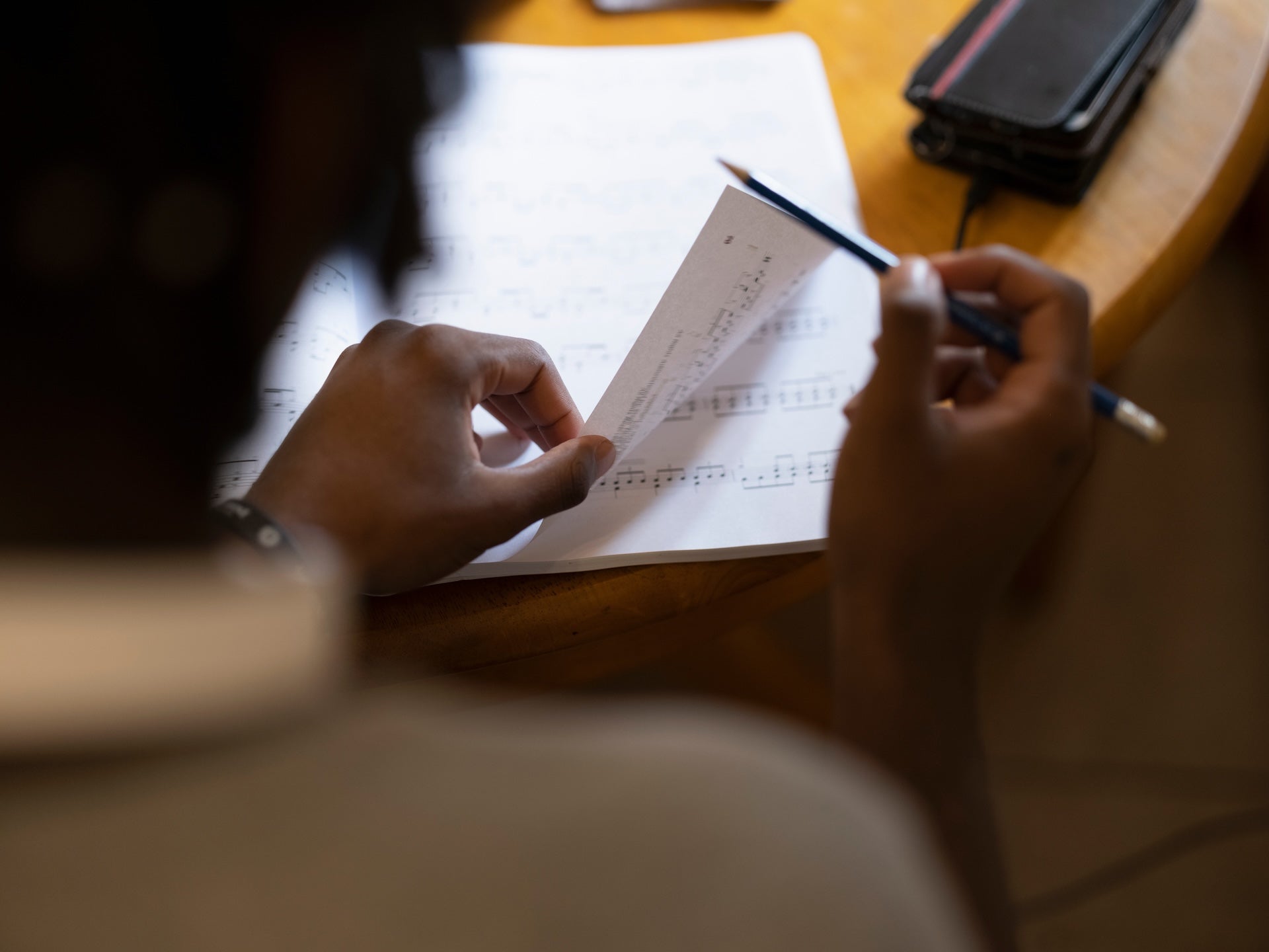 Image of someone using sheet music.