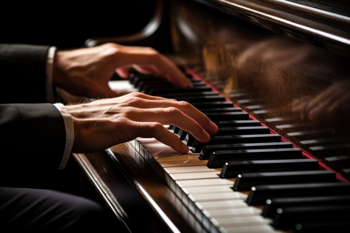 Image of hands playing piano