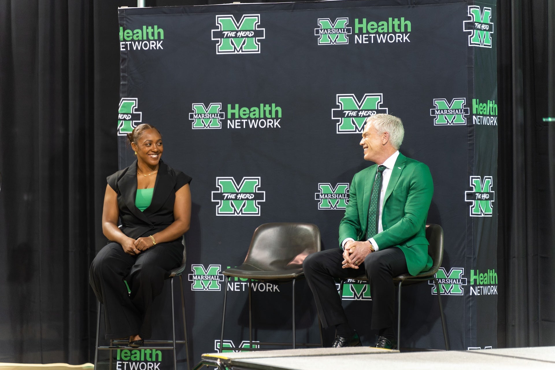 Image of new Stunt Progrma Coach Evyn Richard with Marshall President Brad D. Smith