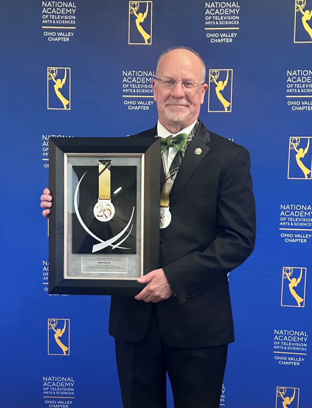 Man holding award