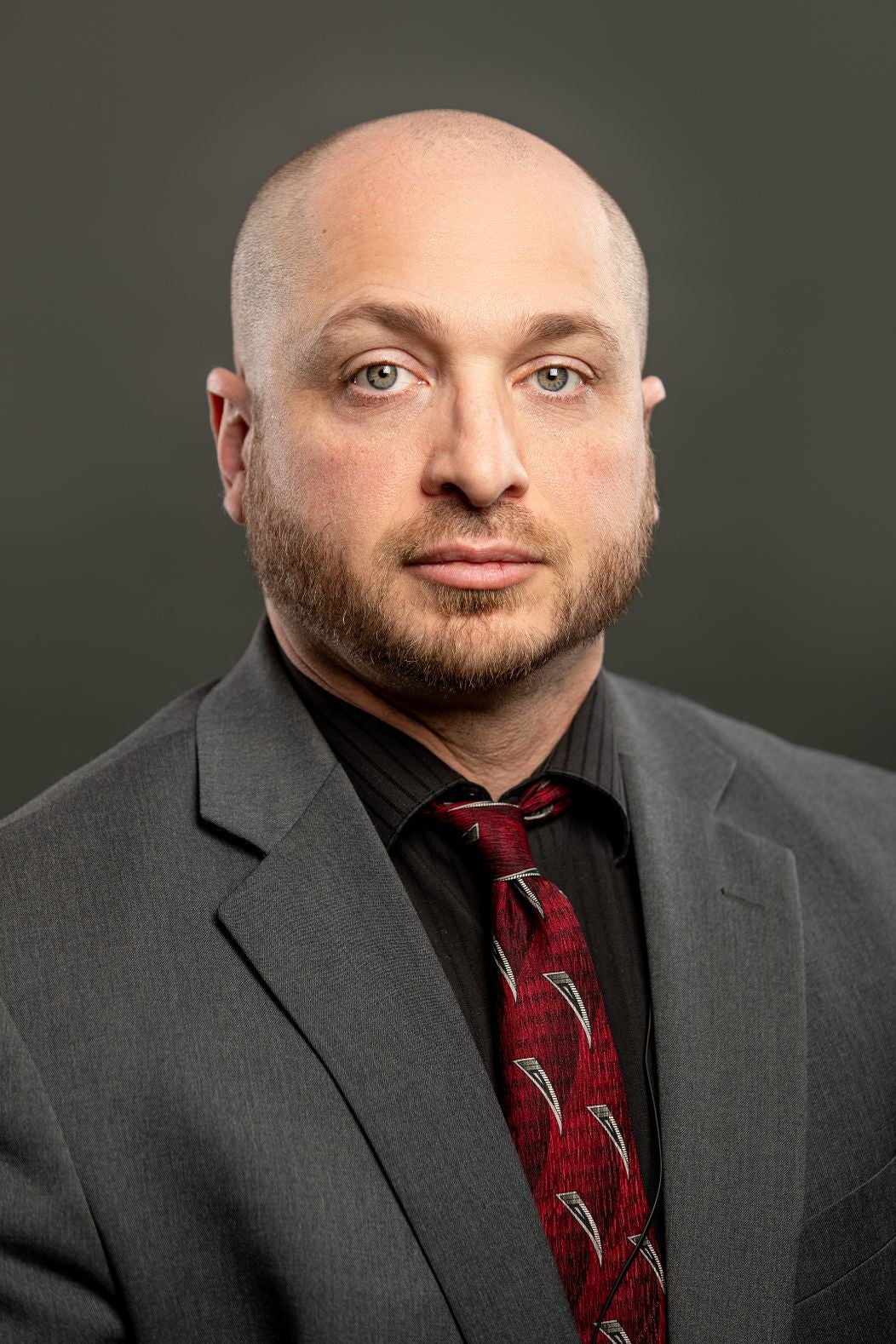 Man in a suit with red tie