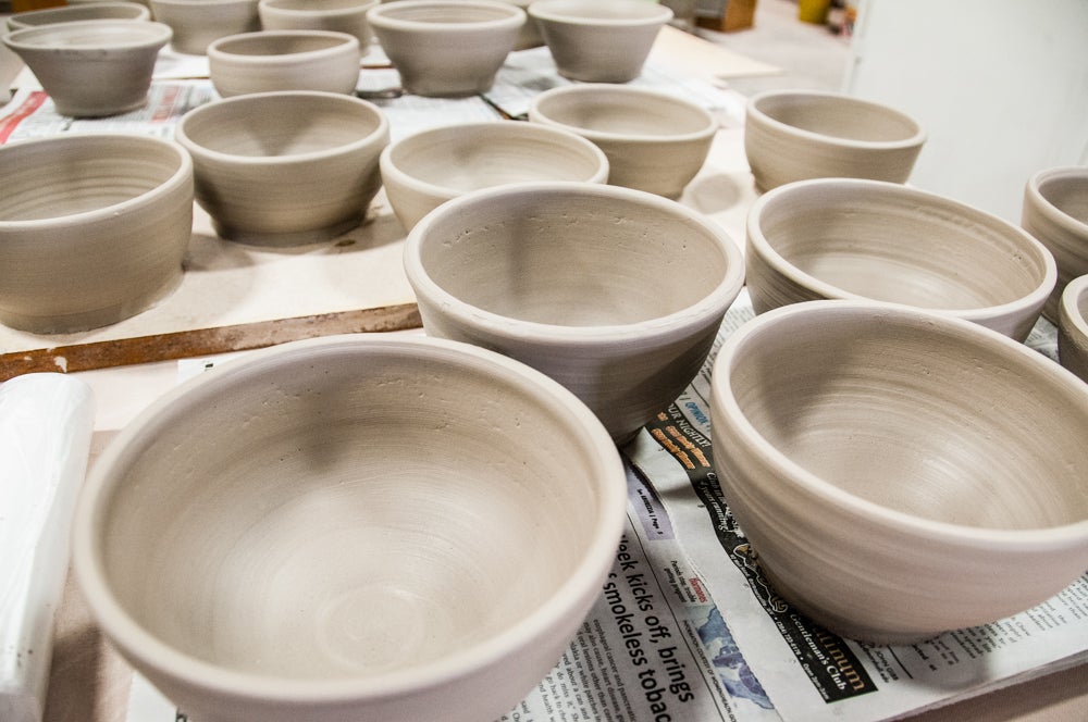 Close up of unpainted pottery bowls.