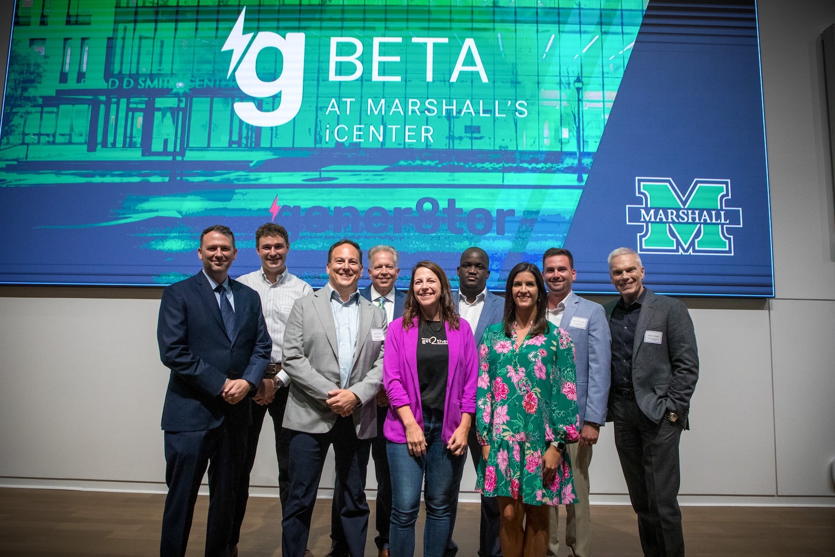 group of people smiling at the August 2025 during the gBETA pilot showcase at the Brad D. Smith Center for Business and Innovation.