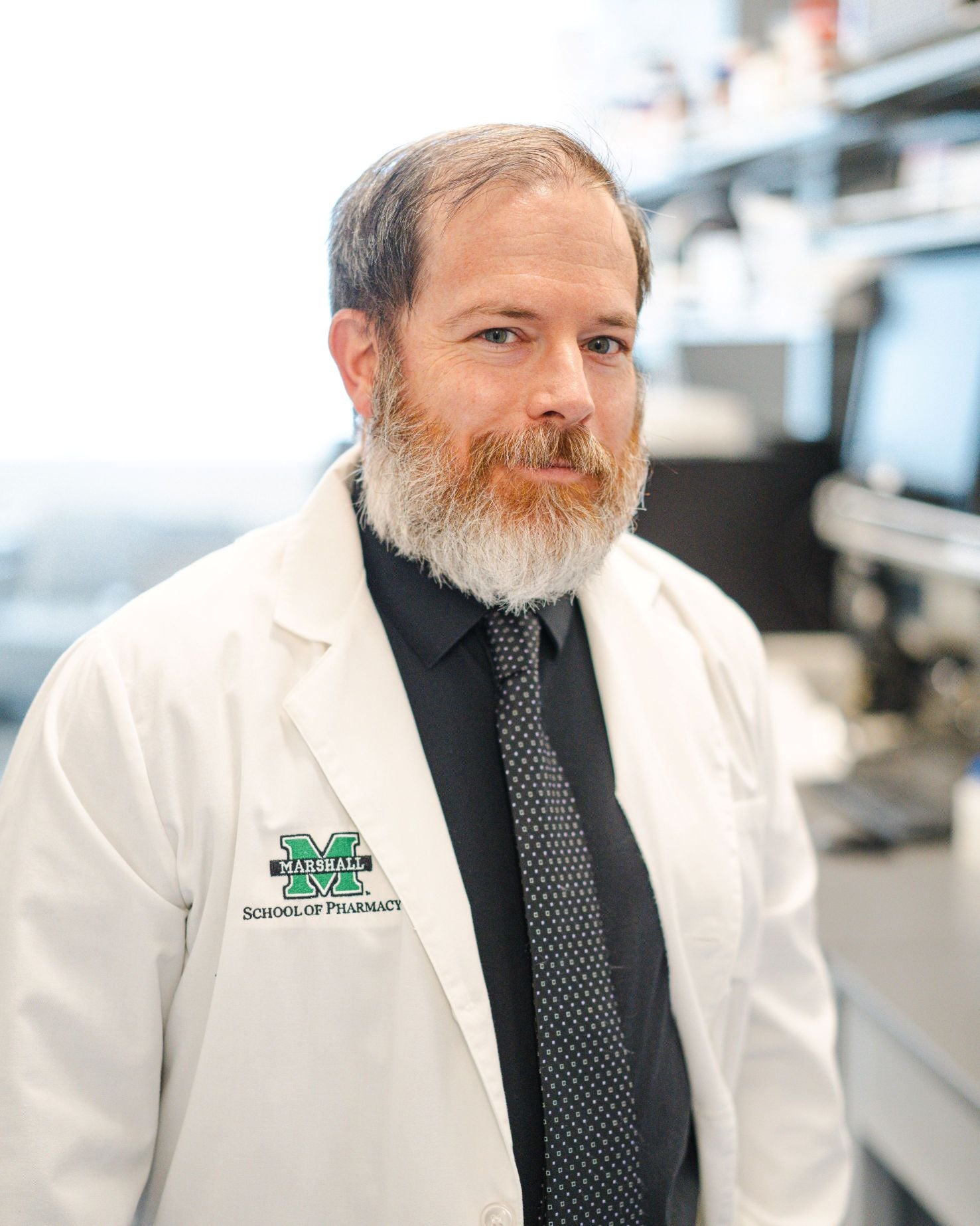 Male in white lab coat