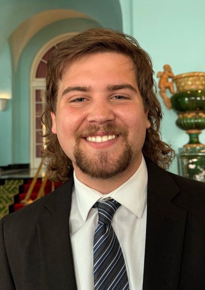 Young man in a suit.