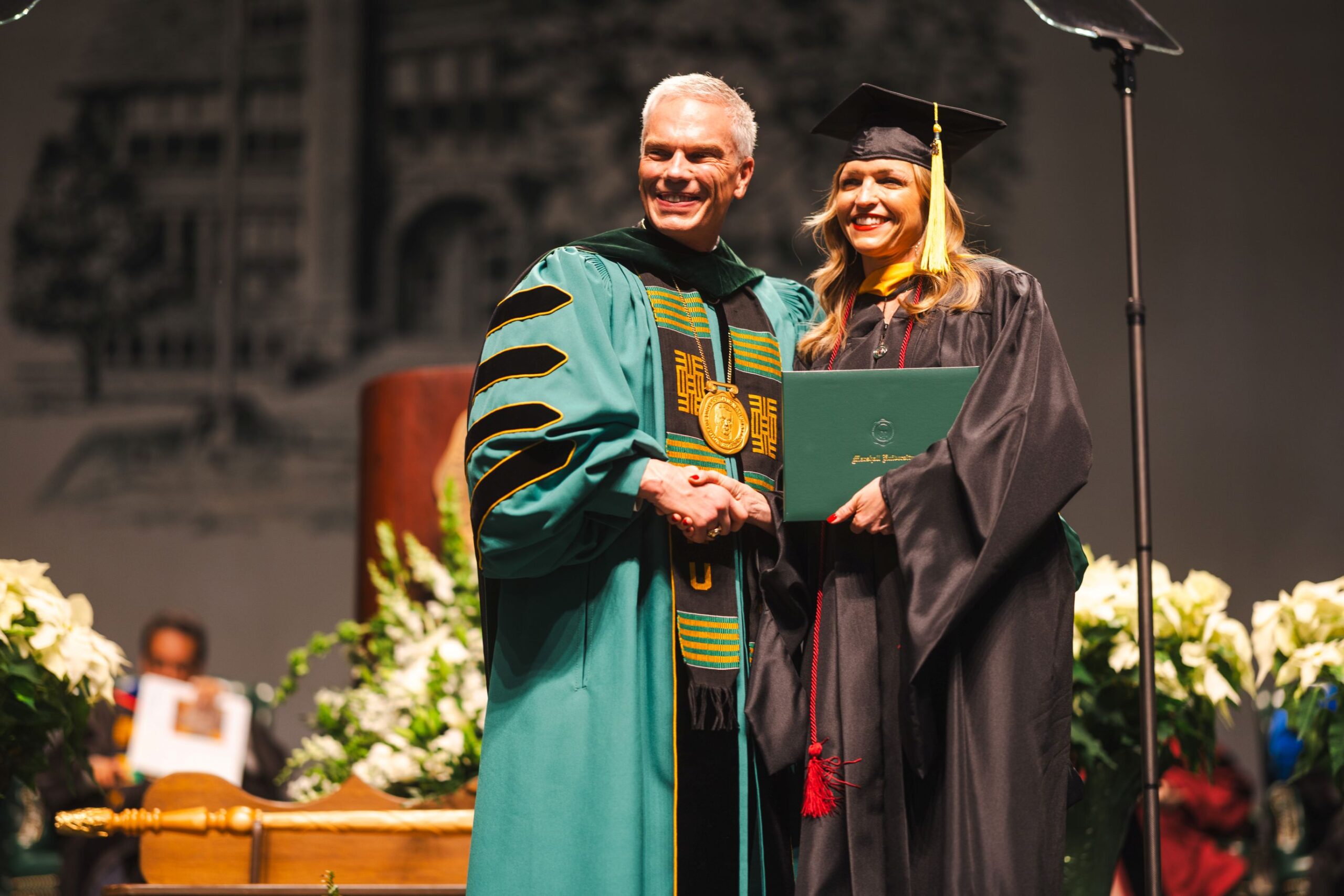 Student receiving diploma at graduation.