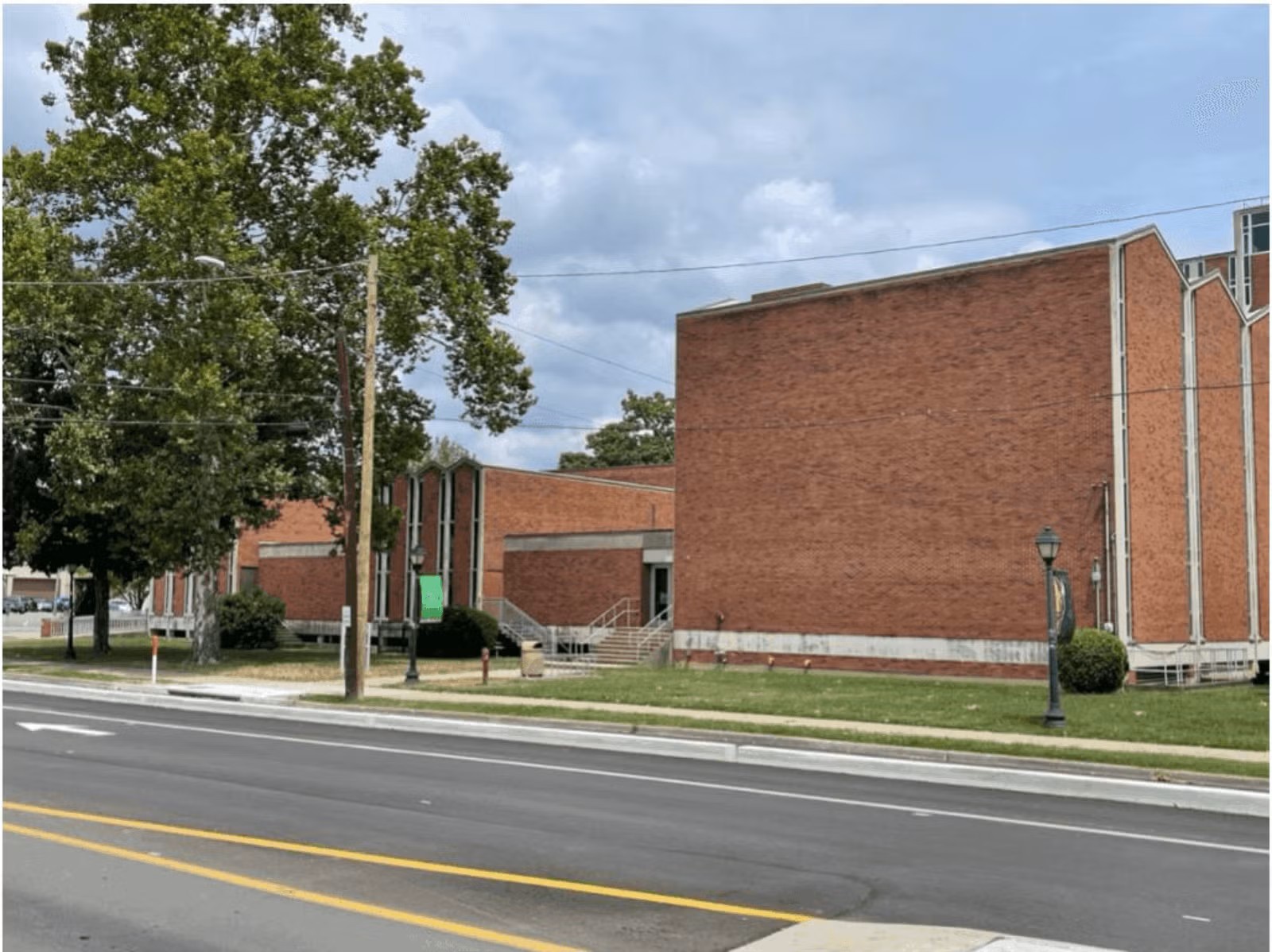 Two-story brick building beside roadway