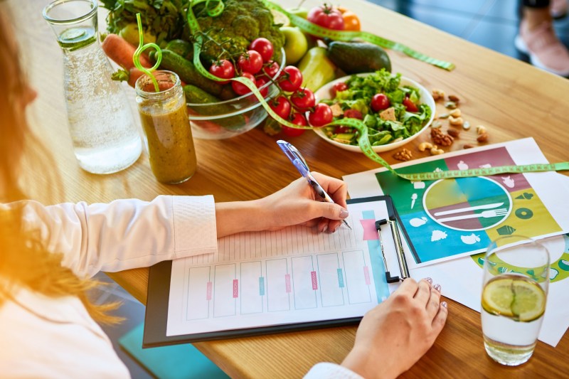 Image of Woman dietitian in medical uniform
