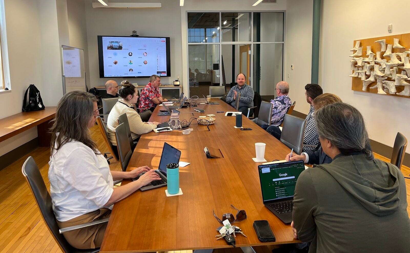 faculty watching a presentation during AI days