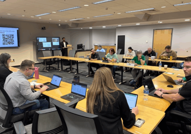 room of people talking before presentation