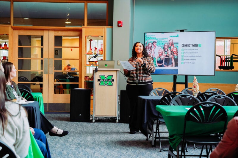 Lalicia presenting at a conference in Drinko Library
