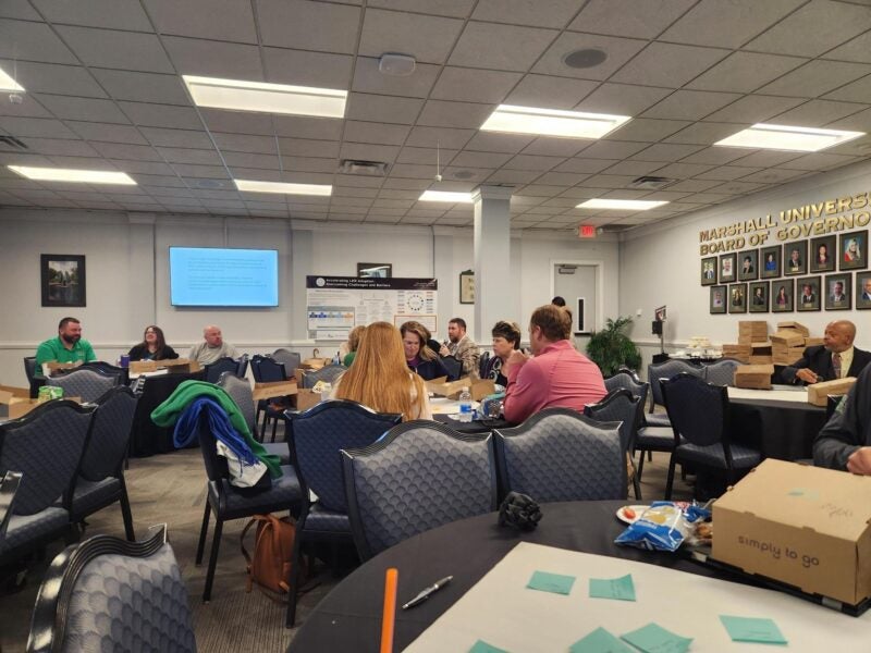 Participants collaborate in small groups during a Marshall Online LER Accelerator Initiative working session.