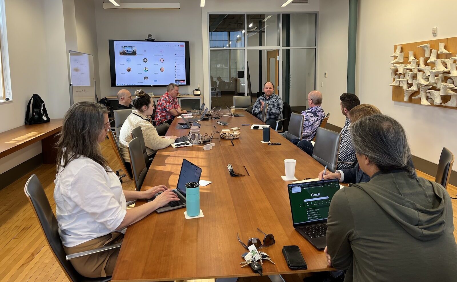 faculty watching a presentation during AI days
