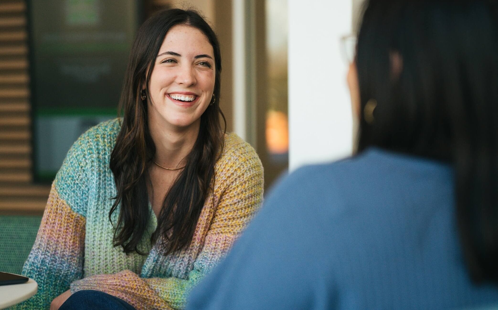two students smiling and laughing