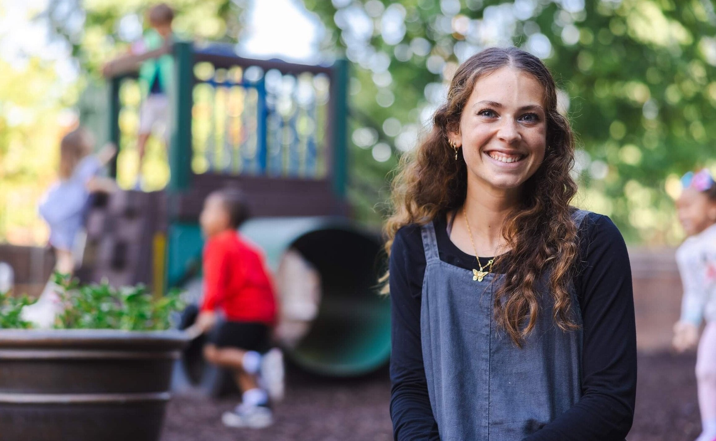 student sitting on a playground
