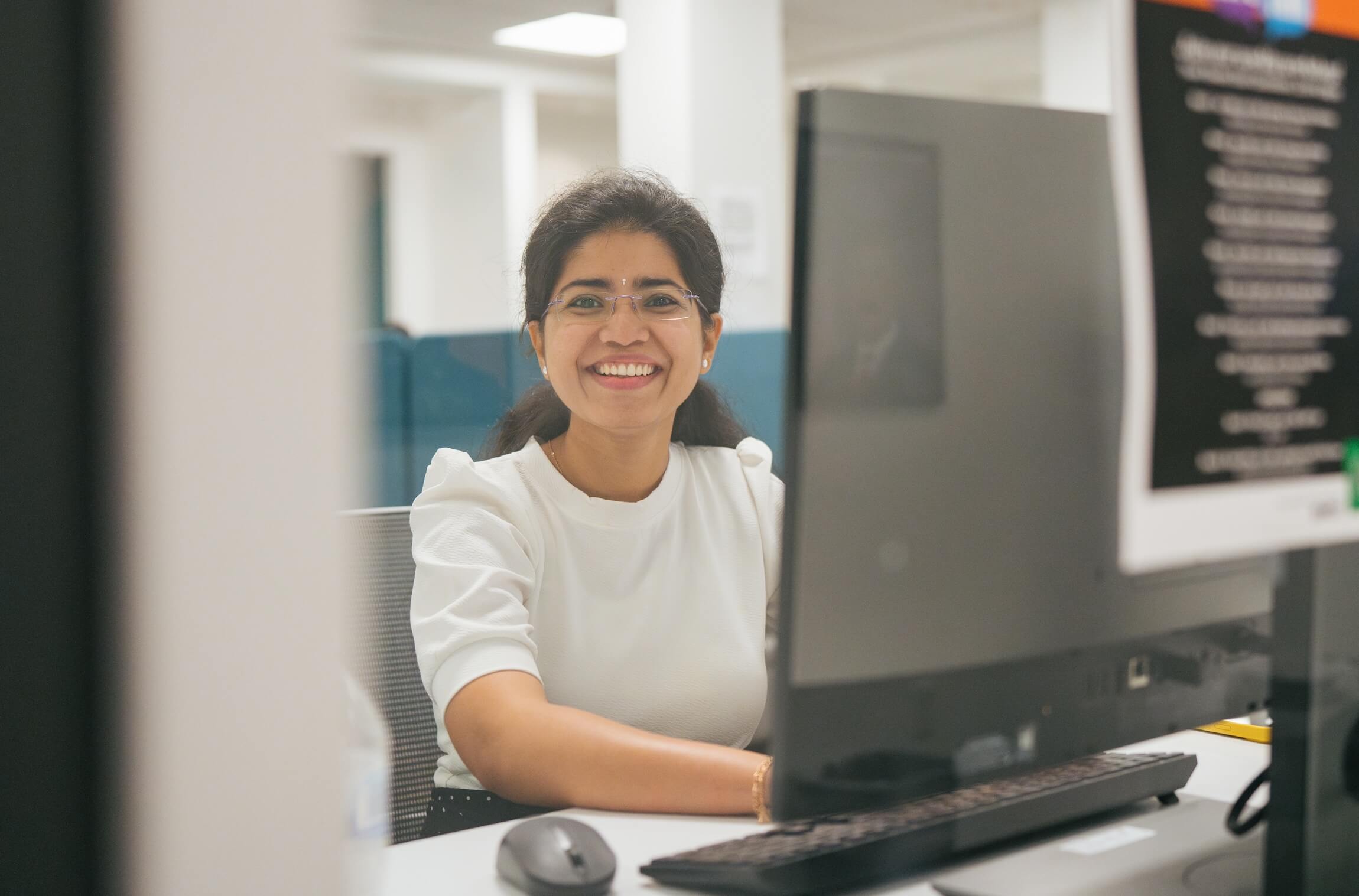 student working at a desktop computer