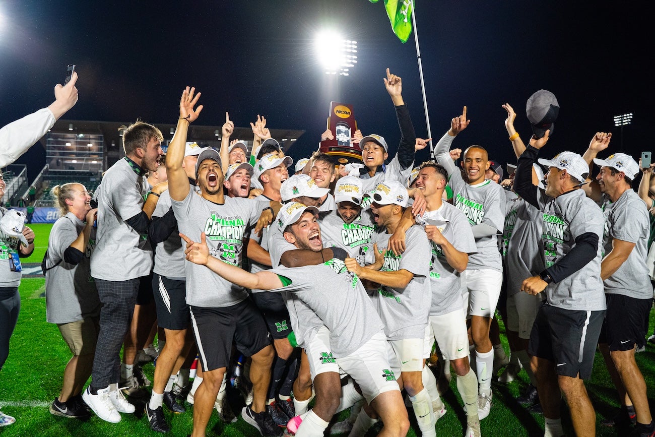 Men's Soccer team celebrating after winning the national championship