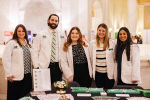 picture of pharmacy students in white coats