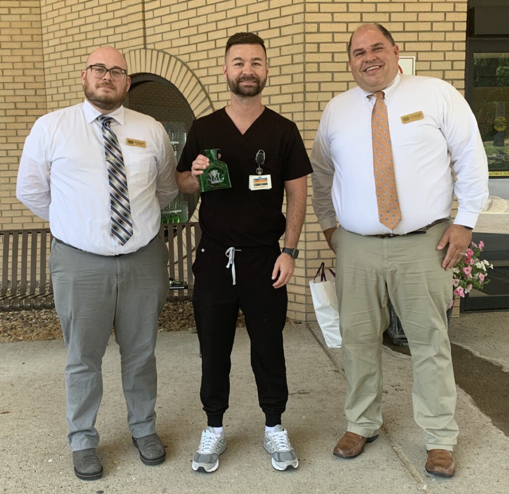 picture of nick adams and craig kimble with a student preceptor
