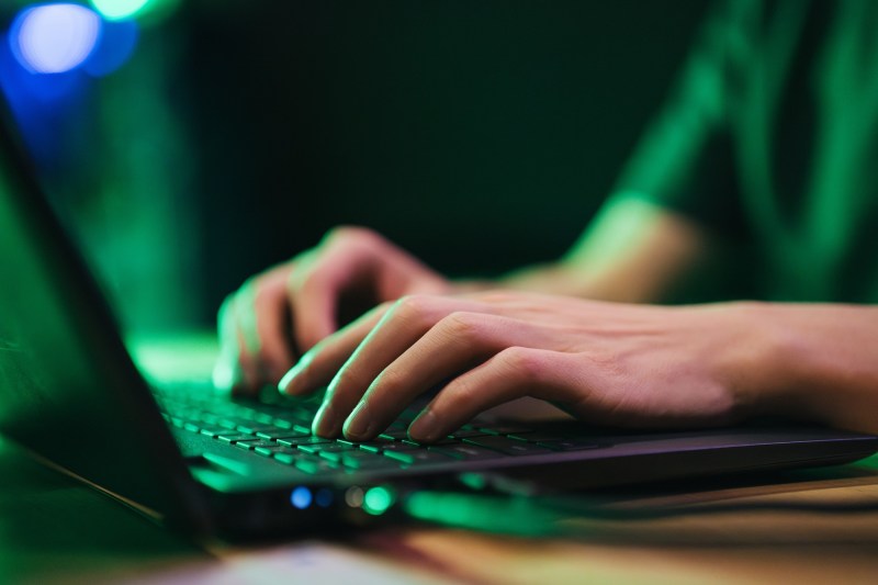 hands typing on a keyboard in the Cyber lab