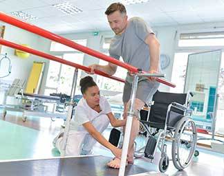 Occupational therapy session showing a therapist assisting a patient with a hands-on activity to improve coordination and daily living skills