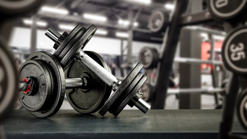 two dumbbells stacked on each other in a gym