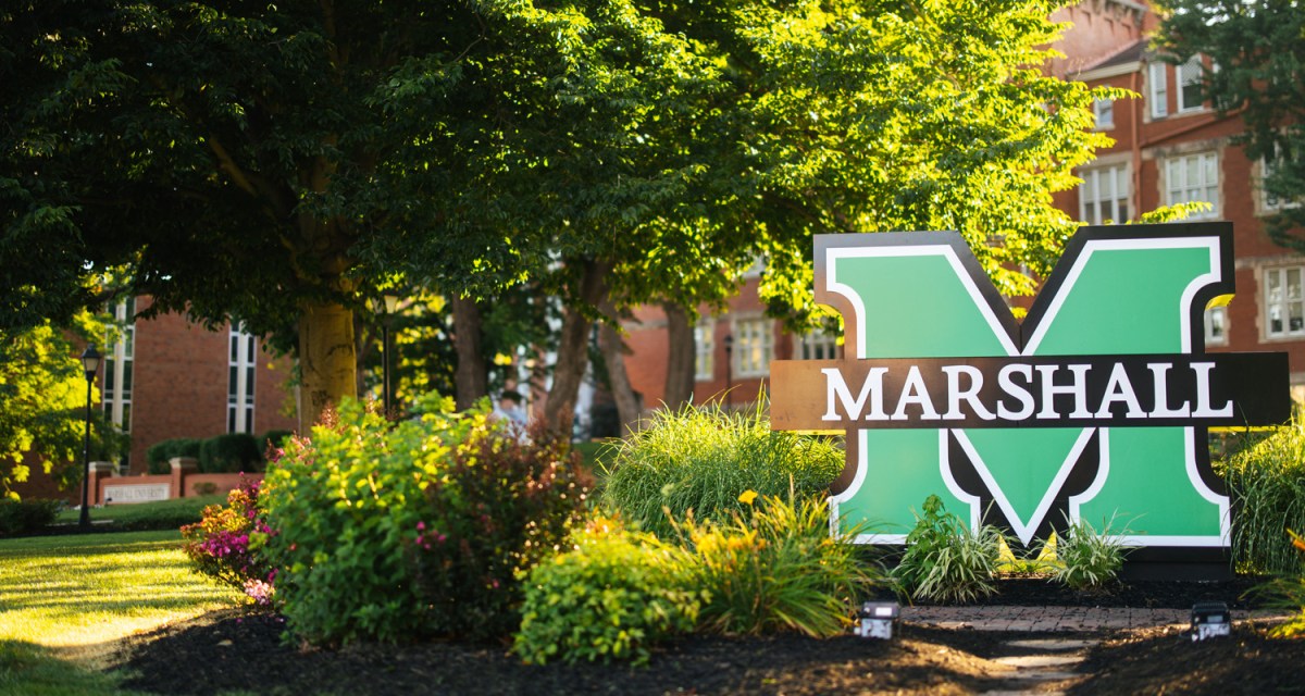 Marshall University sign in front of Old Main on Marshall's Huntington campus