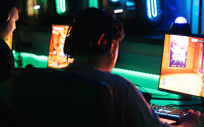 A student participates in Esports in Marshall University's gaming lounge