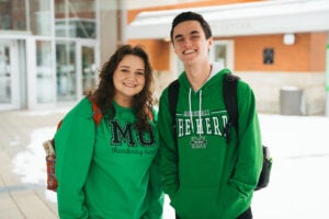 two marshall students standing together and smiling
