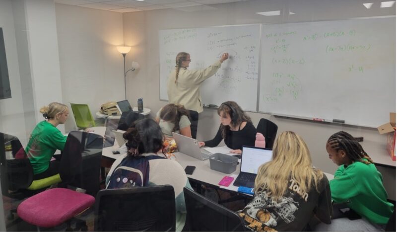 group of students working together in a study room in East Hall