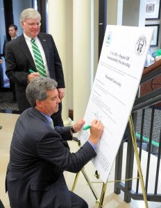 Marshall University President Stephen Kopp and Shawn M. Garvin