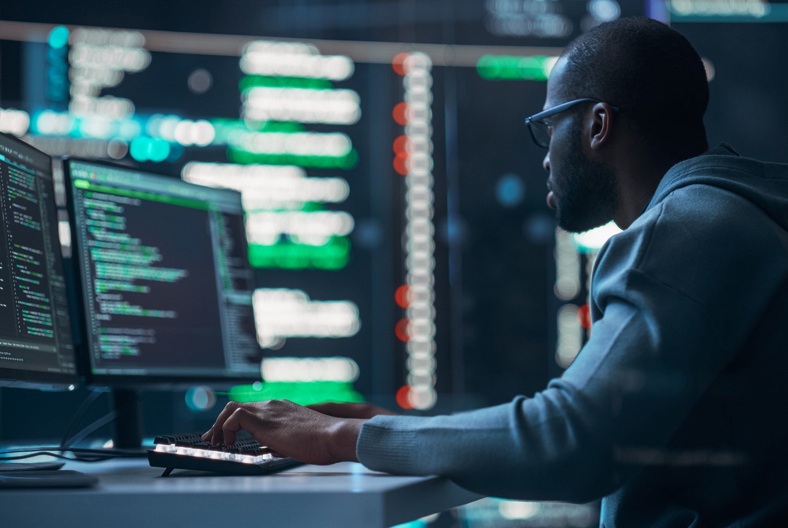 Man at computer in an IT setting