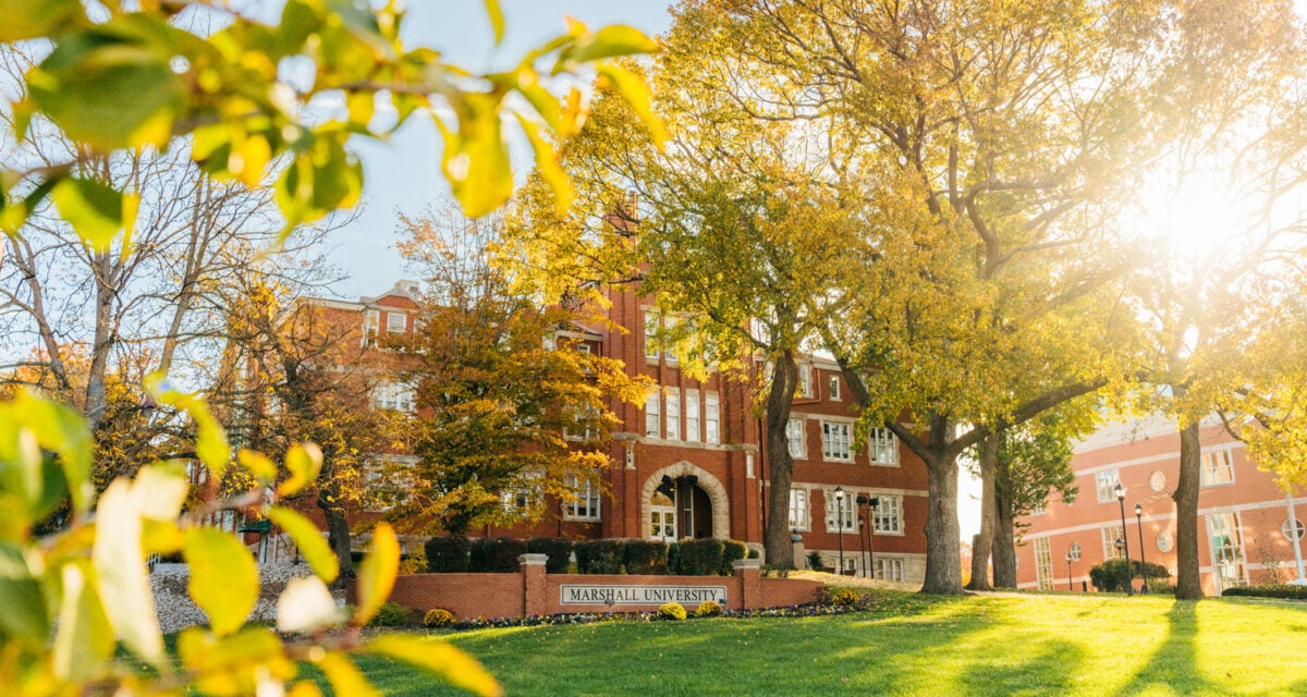 Marshall University's Old Main surrounded by fall leaves
