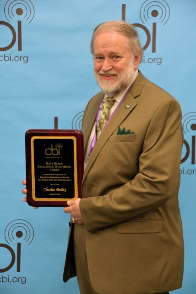 Dr. Bailey at National Student Media Convention in Orlando, Florida receiving College Broadcasters, Inc. Dave Black Excellence in Advising Award