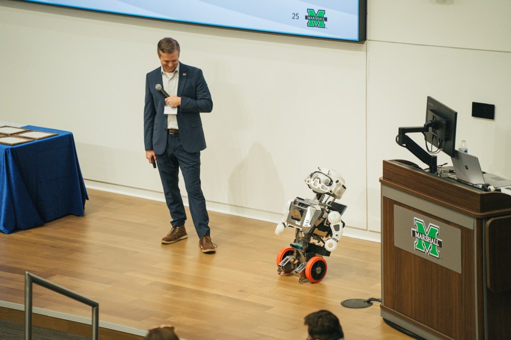 Brandon Dennison presentation with robot