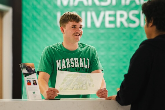 photo of student helping other students in the student center