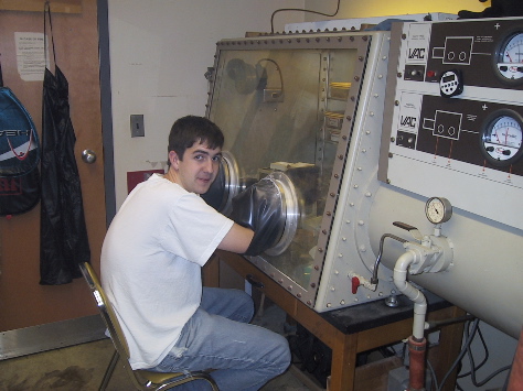 Student using Vacuum Atmospheres glovebox equipped with an HE-493 dri-train (1989)