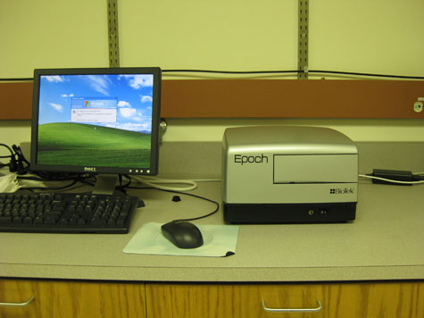 BioTek Epoch Microplate Spectrophotometer (2009) next to a desktop computer