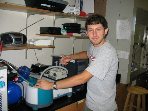 student working on a 2 Cary 50 Bio UV-VIS Spectrophotometers (2006)