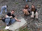 Photo from Sedimentation and Stratigraphy field trip showing students examining field of rocks