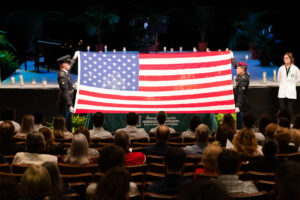 A flag is displayed at the memorial service in honor of the veteran donors 