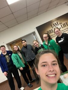 Early Assurance students pose for a photo while serving together at the City Mission