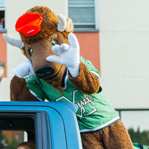 Marco participates in the Marshall University Homecoming Parade