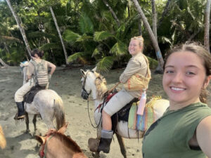 Maggie Dickerson takes a selfie while horseback riding on the Beach in Costa Rica