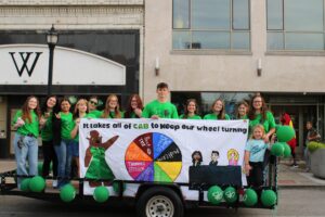 group of students on a homecoming parade float