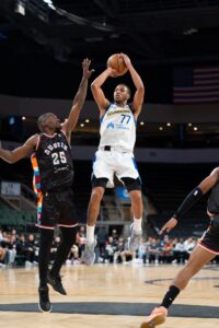 Image of Kinsey high in the air shooting a jumper