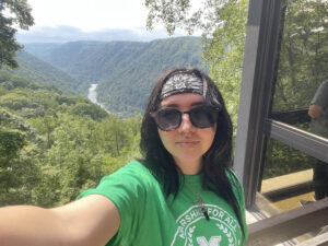 Kayleigh Garcia takes a selfie from an overlook above the New River Gorge