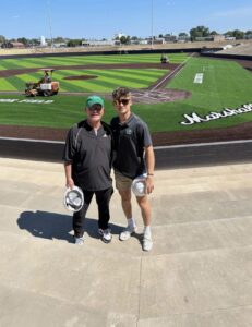 Image of May and Collins at the stadium as it was being built.