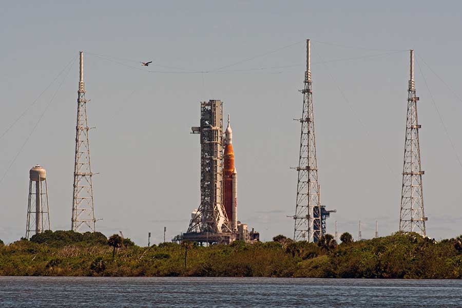 Artemis I Space Launch System rocket and Orion crew capsule on the launch pad at NASA's Kennedy Space Center.