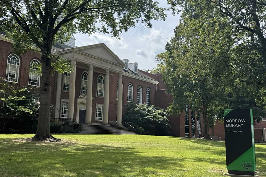 Pair of Freedom Trees flank the former main entrance of Morrow Library, creating a tree-lined view of the historic library facade.
